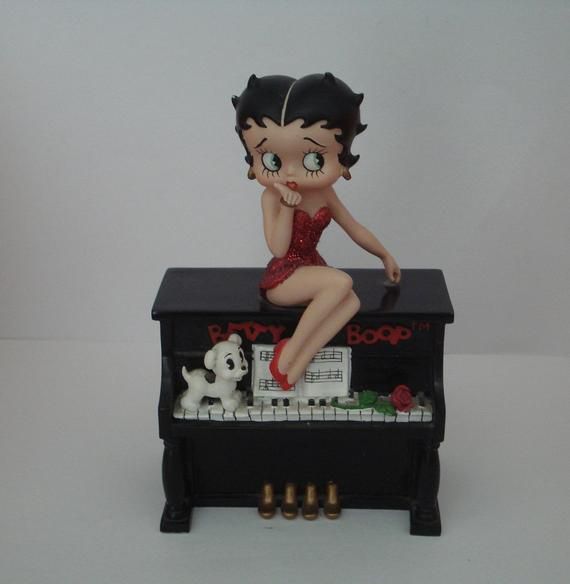 Betty Boop sitting on top of a piano blowing a kiss musical. (Retired and Rare)